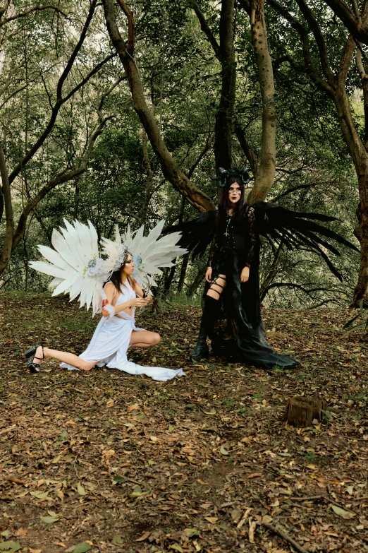 some people in costumes are posing by a tree