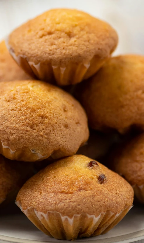 a white plate topped with lots of muffins