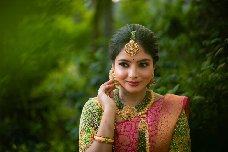 a woman in traditional dress poses for a po