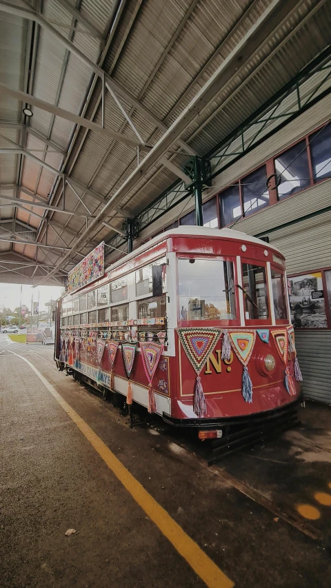 the public transit tram is parked at the station