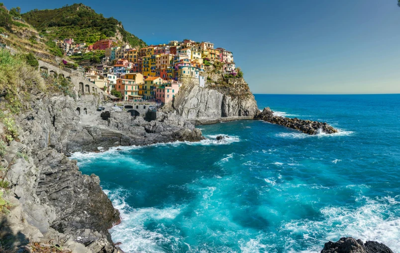 a cliff on a beach overlooking the ocean