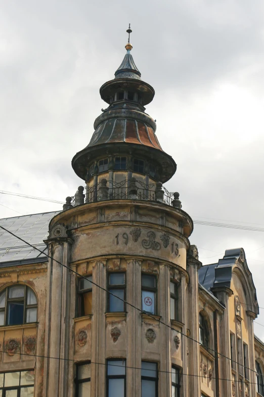 a large building with a clock mounted to it's top