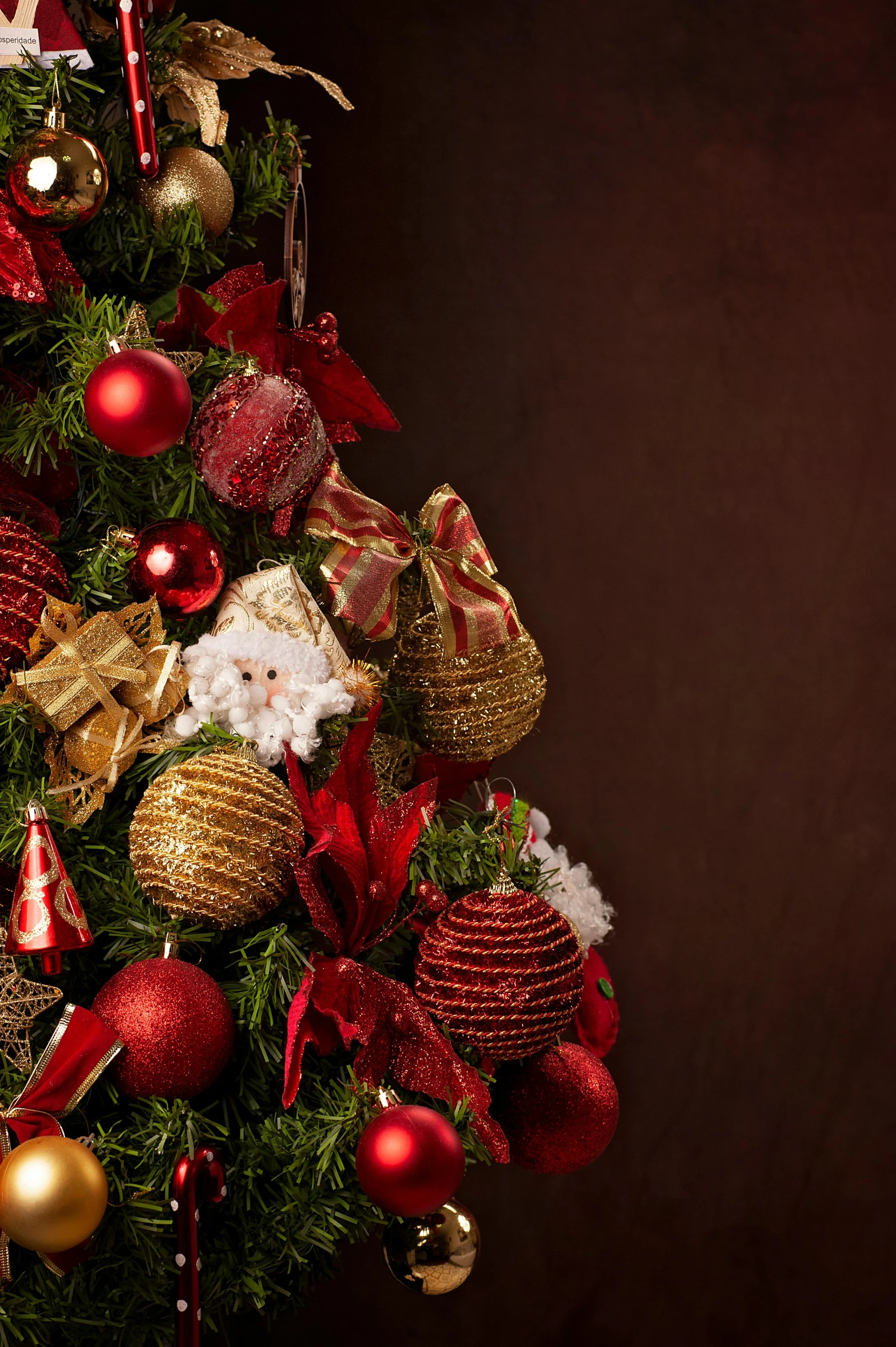 a small decorated christmas tree with ornaments