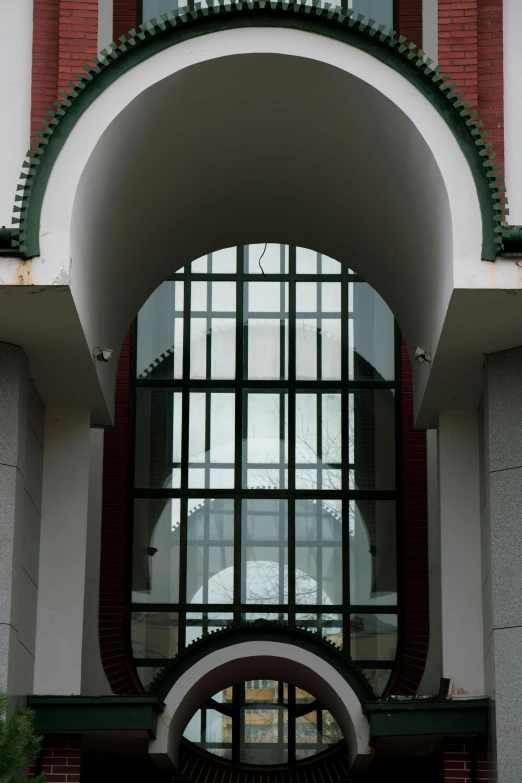 an arched entrance with multiple windows to let light in