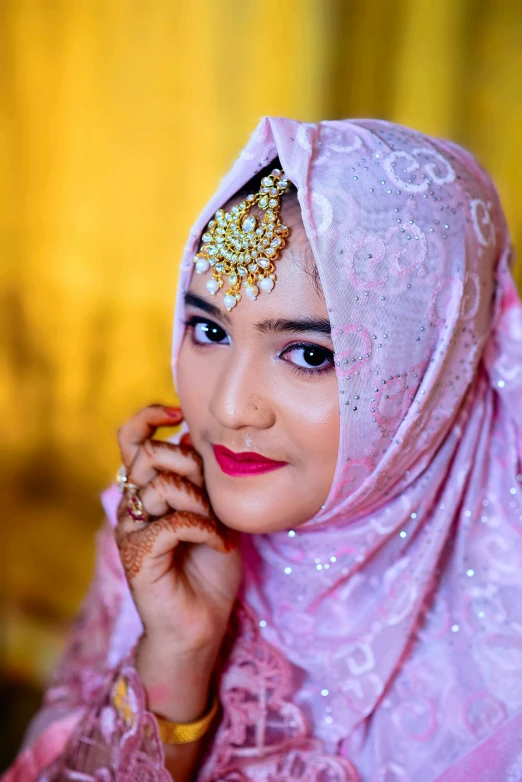 a young woman is wearing a veil and posing