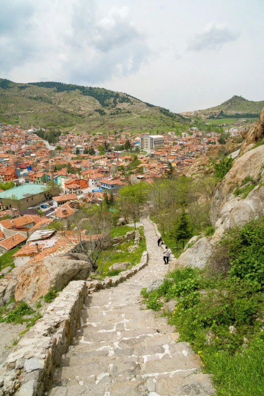 people hiking up to the top of the hill