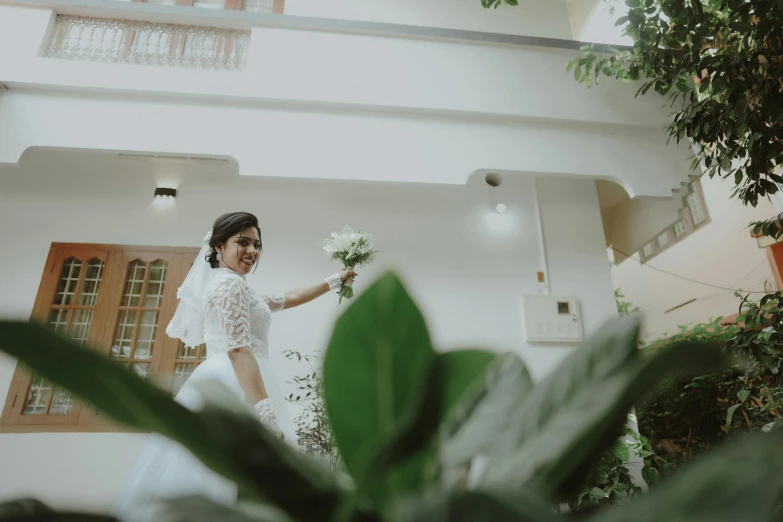 the bride is walking down the aisle in her white wedding dress