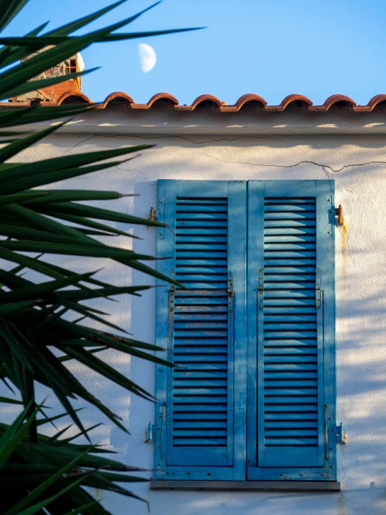 blue shutters that look like they are open outside