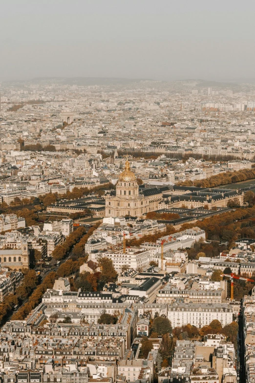 view from above of tall white buildings with brown roofs