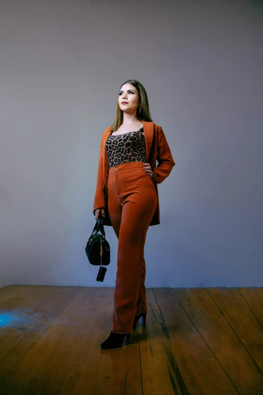 a girl with her head tilted wearing an orange outfit