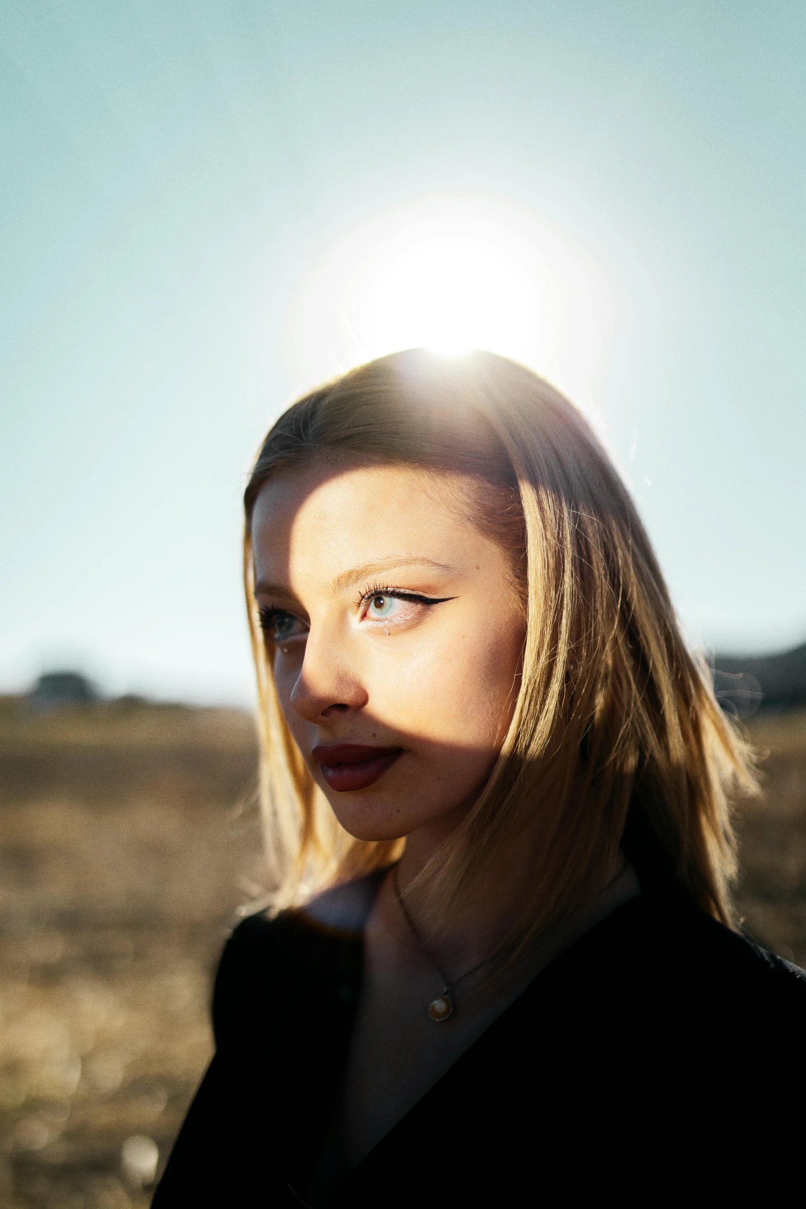 a woman in black shirt staring at soing