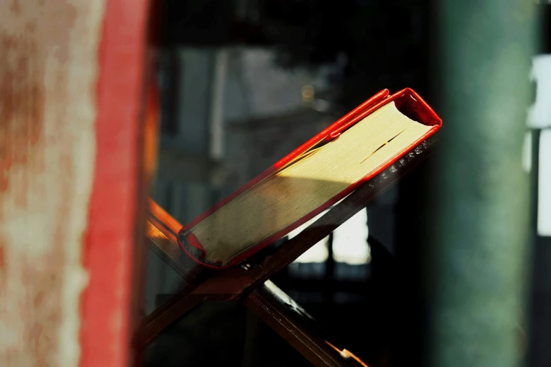 an open book sitting on top of a stand