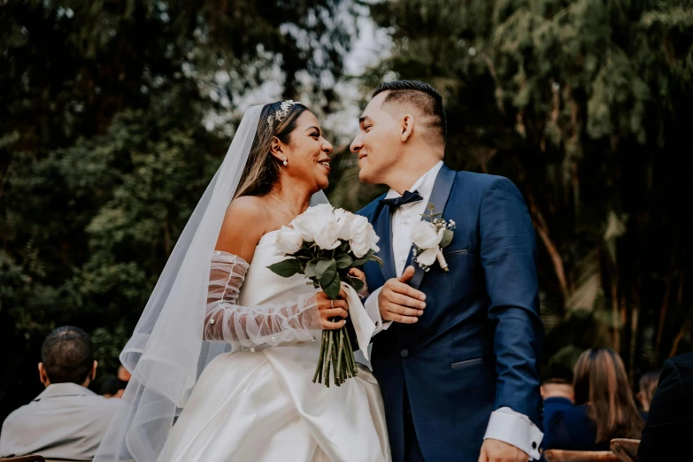 the couple is dressed up for their wedding ceremony