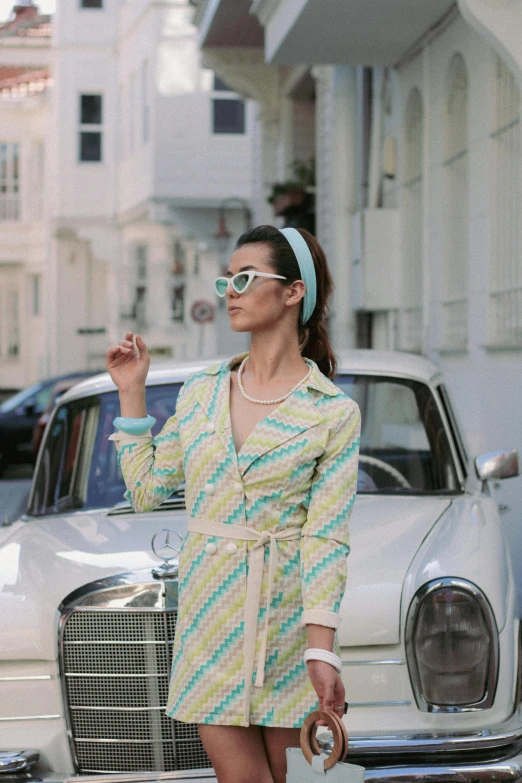 a woman in a green and white dress