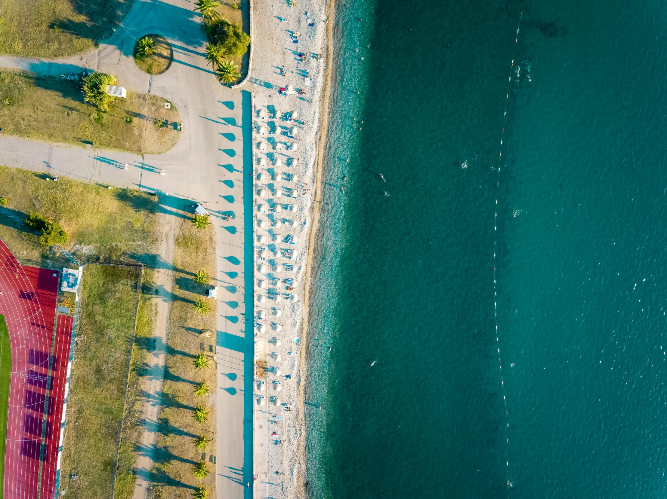 aerial view of a beach and blue water