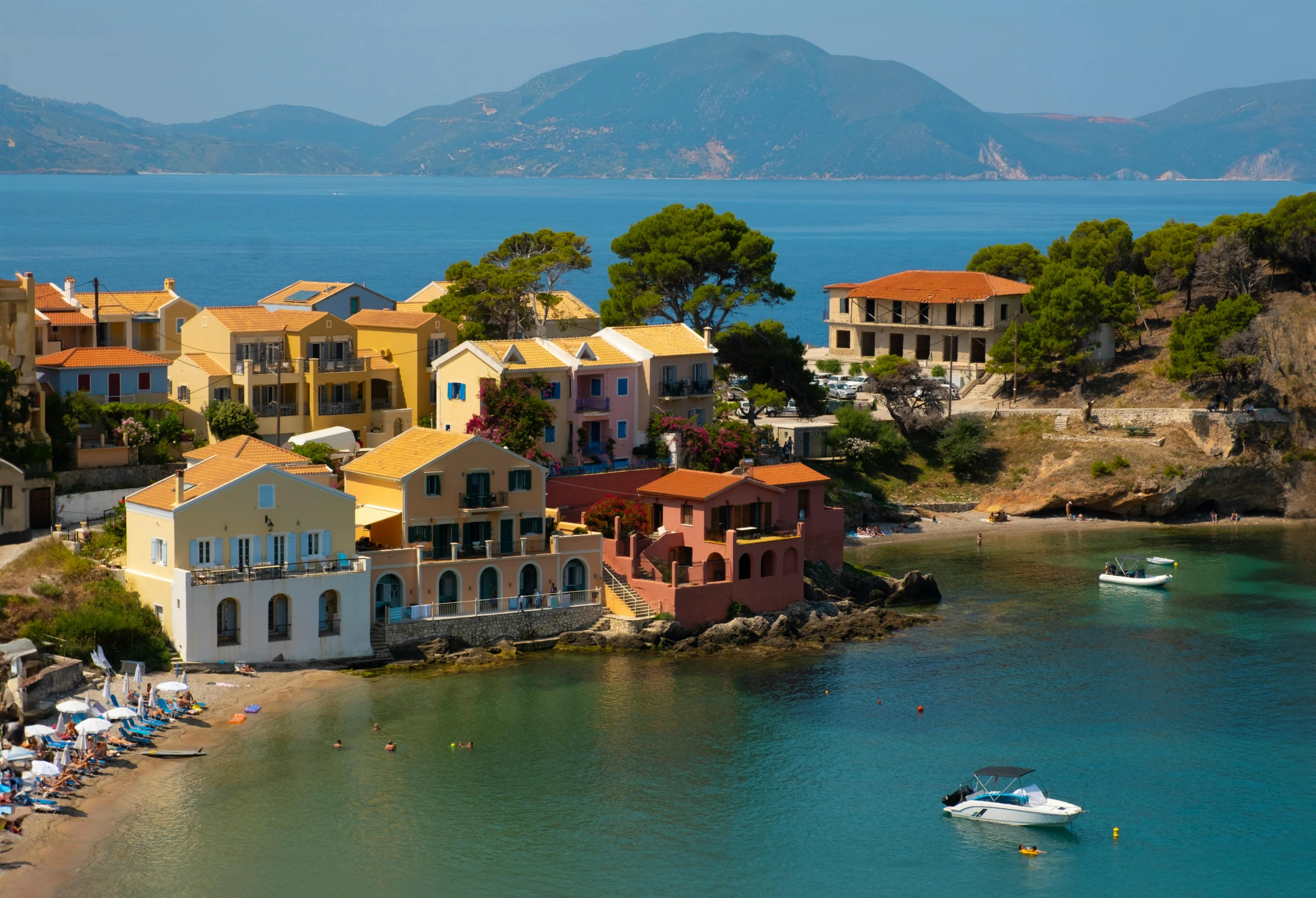 an aerial view of a town by the water