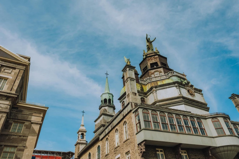 a clock tower stands above an old building