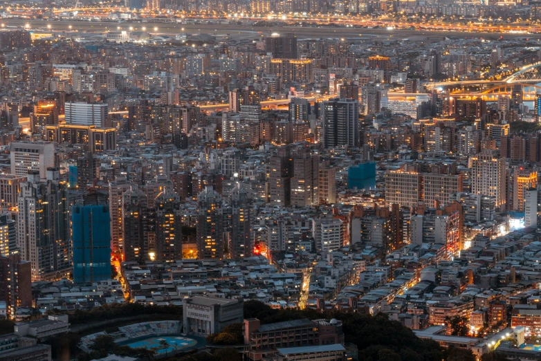 a large city skyline is lit up at night