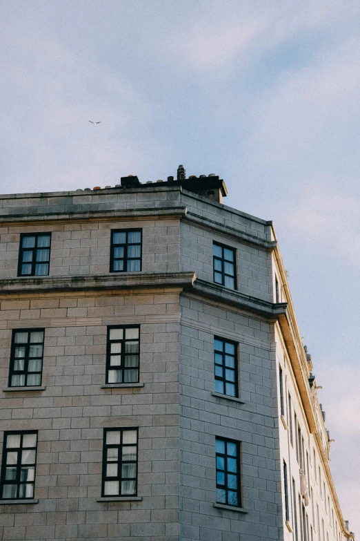 there is a brick building that has a clock at the top