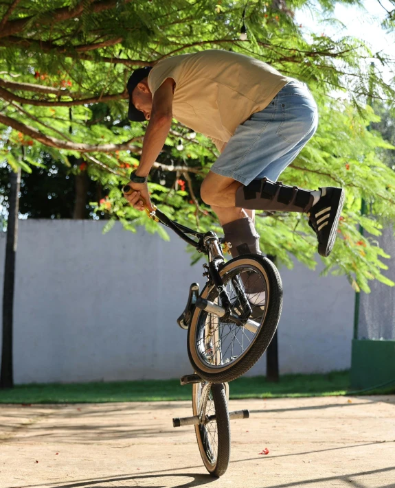 this man is doing a trick on his bike