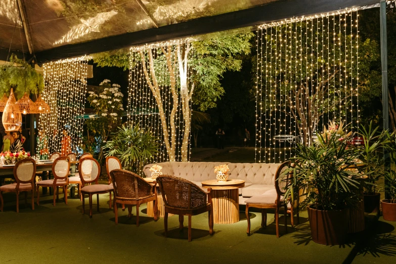 an outdoor room decorated in different types of lights