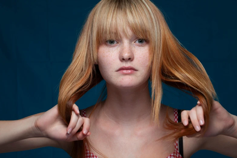 a closeup of a young woman with long hair