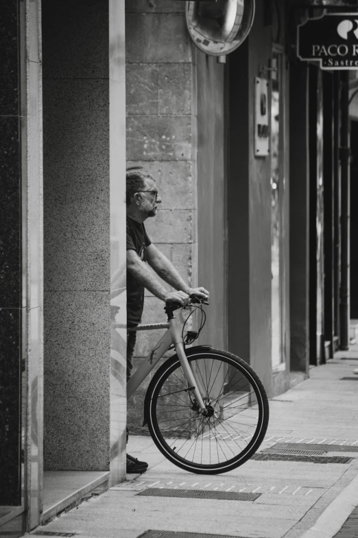 a bicycle leaning on the wall of a building