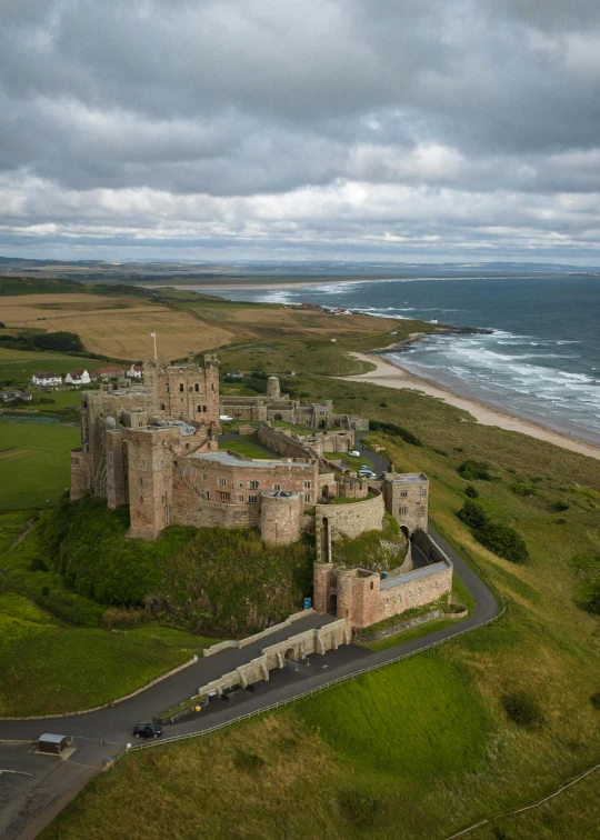 an aerial s of a castle and ocean