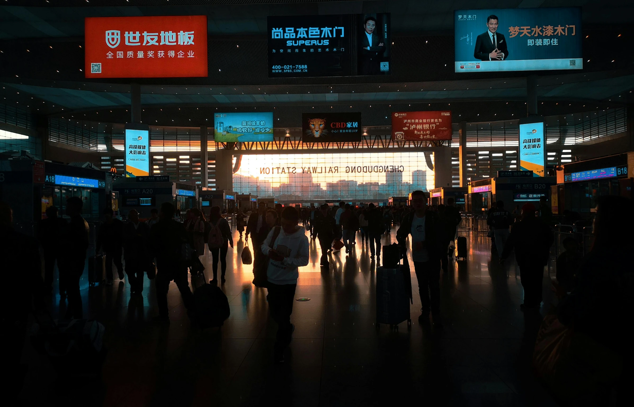 silhouettes are seen in the dark at an airport