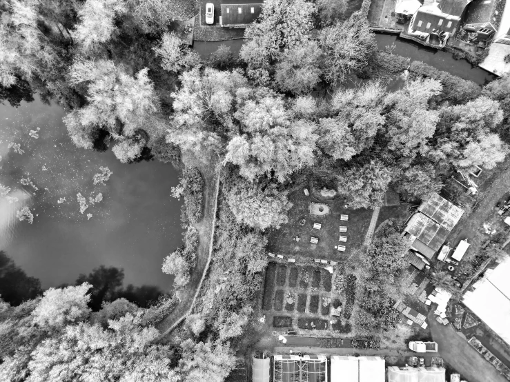 an aerial view looking down on a town next to the lake