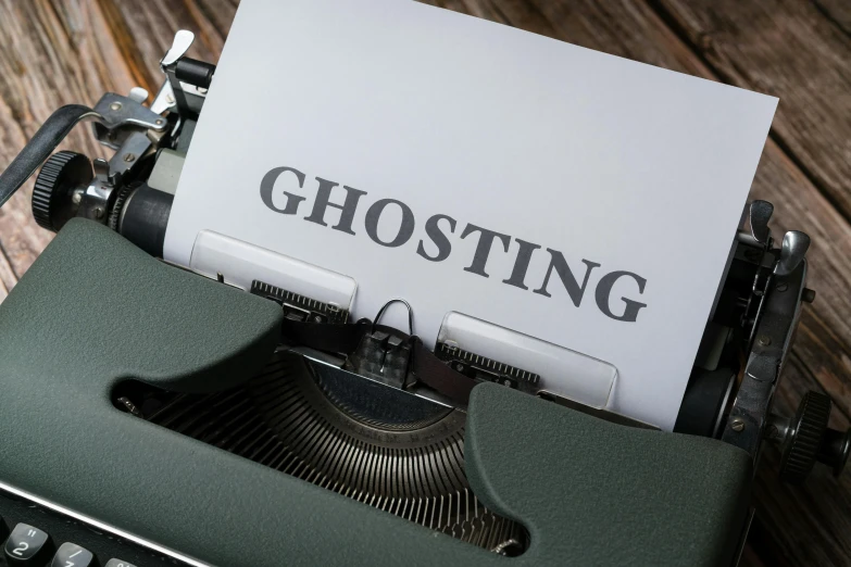 a typewriter with the word ghosting written on it