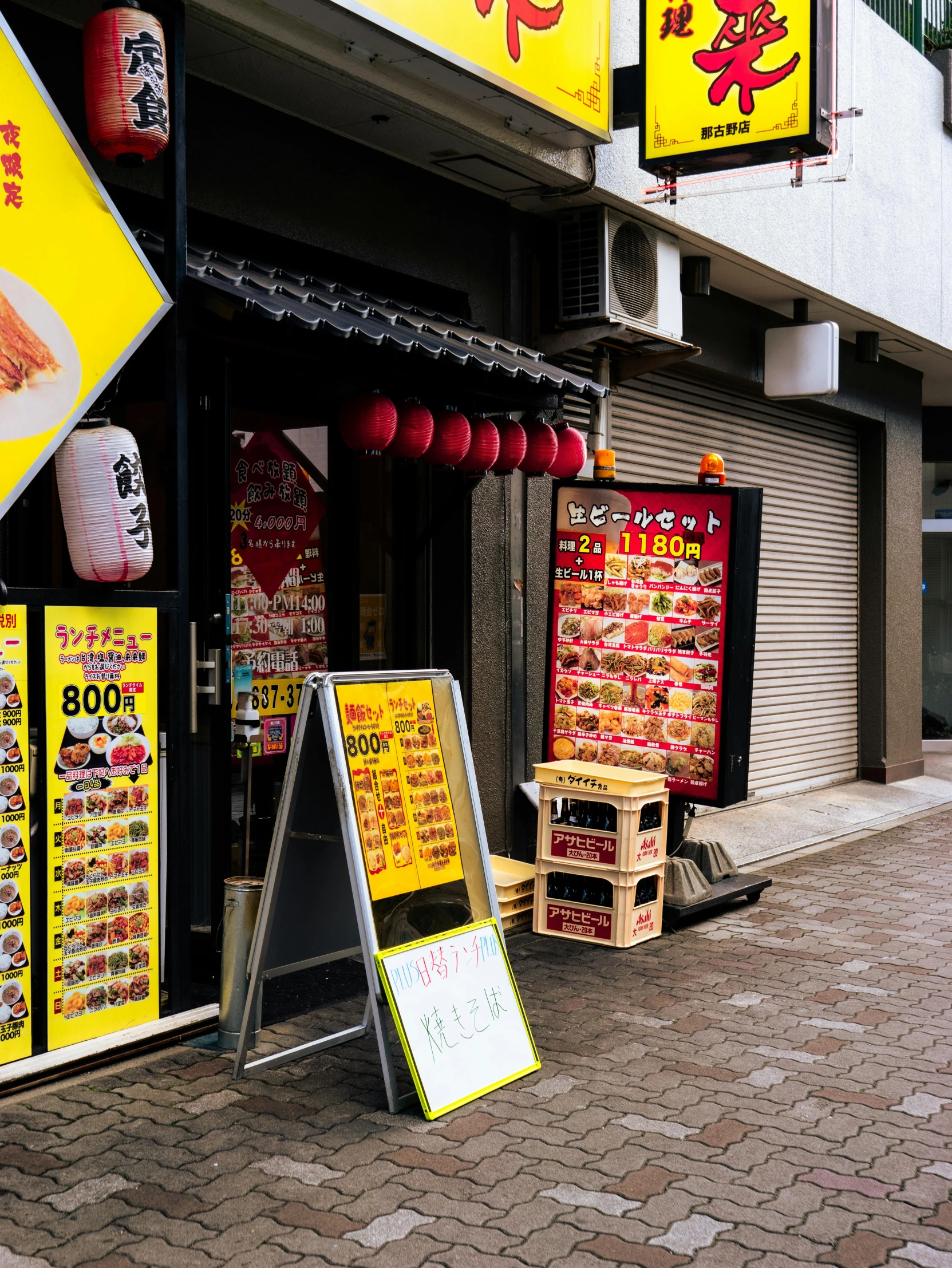 a view of a chinese restaurant with signs on the side