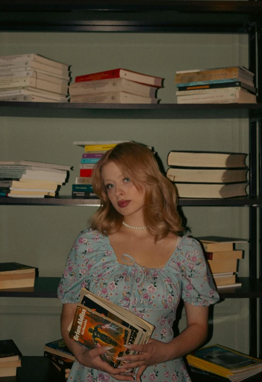 a girl is standing near some shelves with books