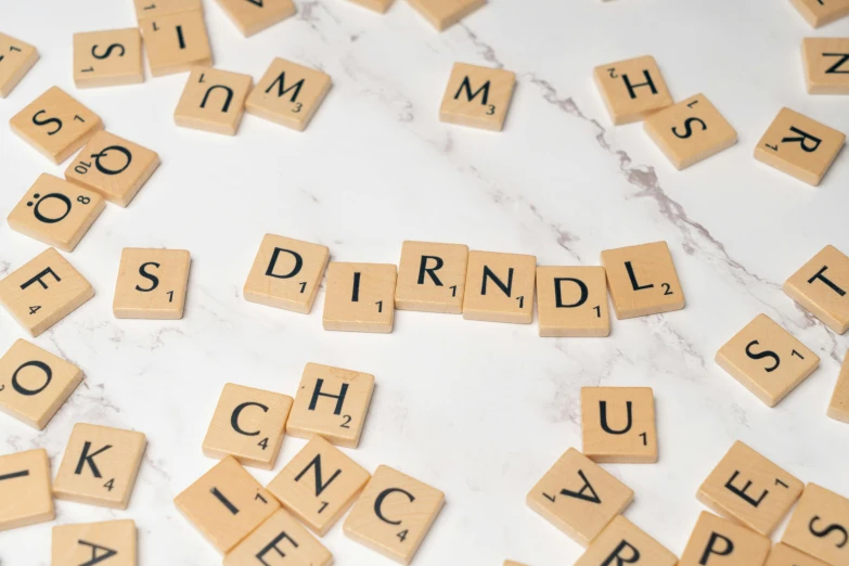 many letters made with scrabble tiles laid out