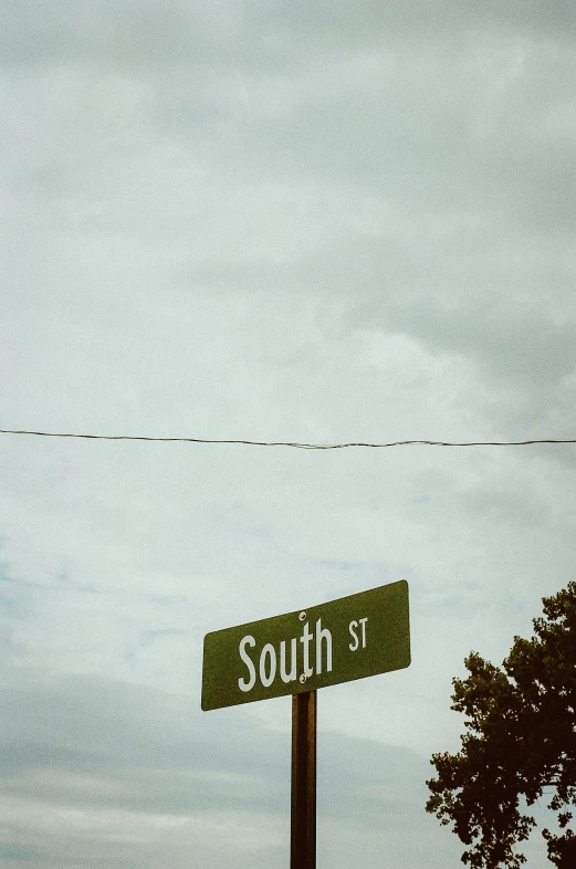 this is an image of street signs with a telephone pole in the background