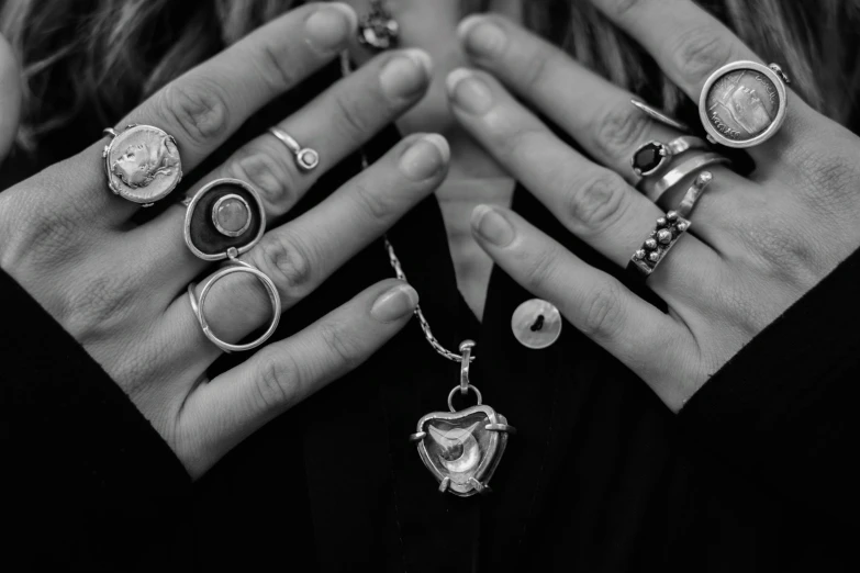 a woman with five different rings on her hands