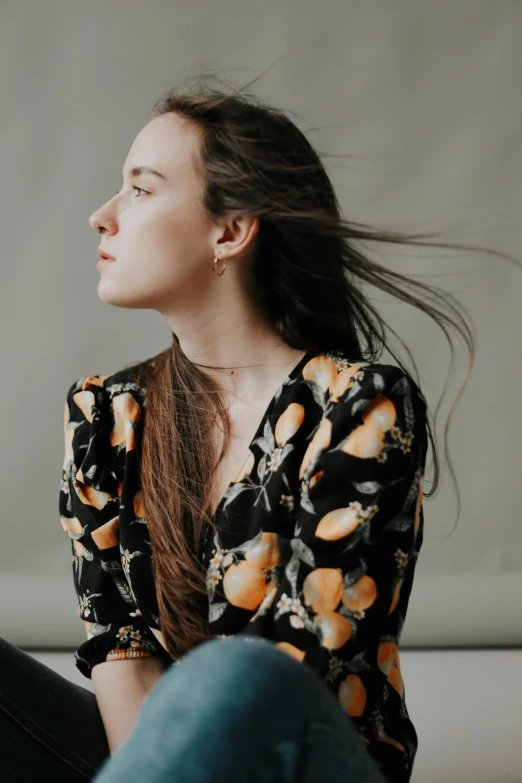 a woman with her hair in a ponytail looking up at soing