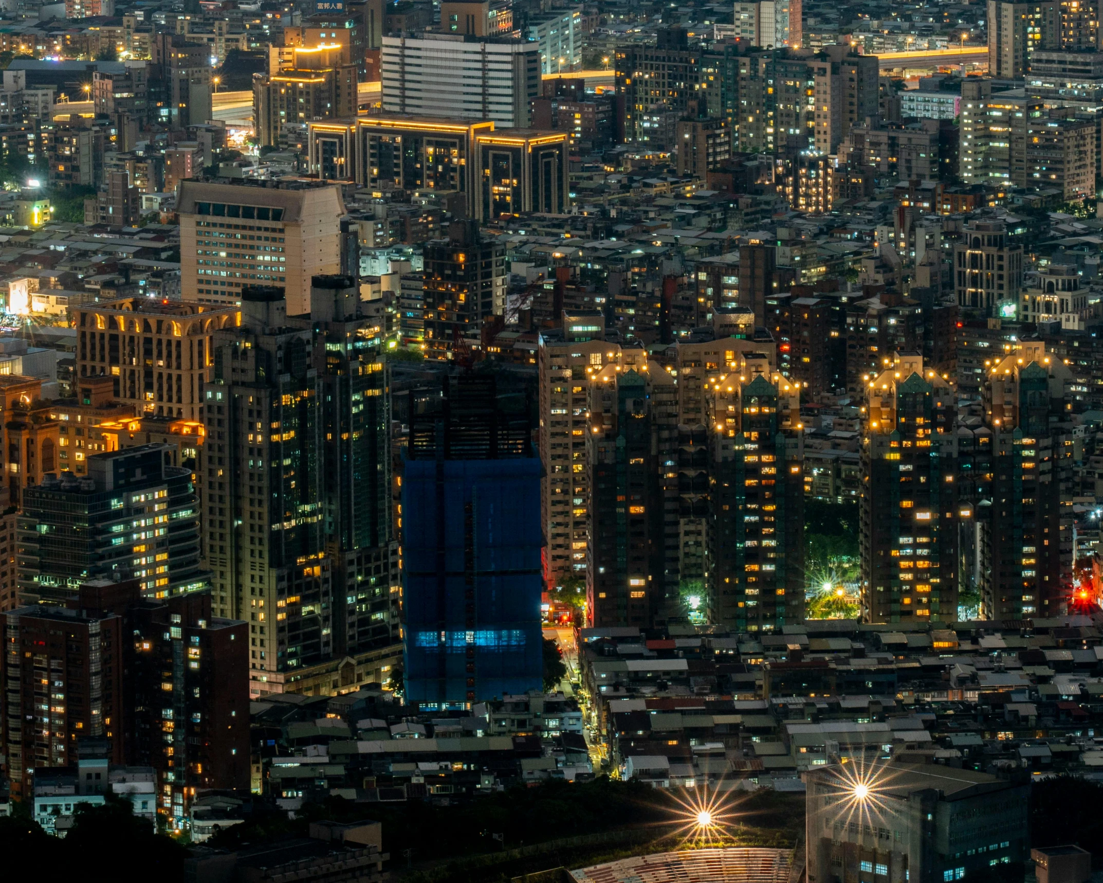 the buildings of an urban city at night