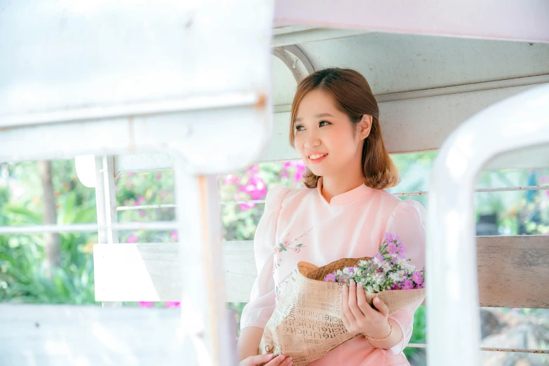 a woman posing for the camera, her hair and flowers