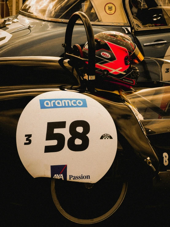 cars with numbered tires for sale sit in a car showroom