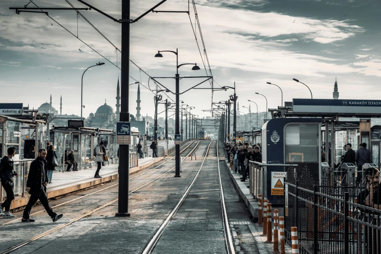 a group of people walking on a train platform