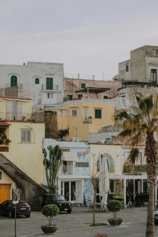 a colorful city with tall buildings, palm trees and buildings