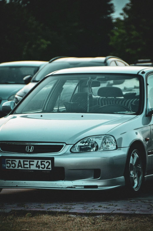 several cars parked together in a parking lot