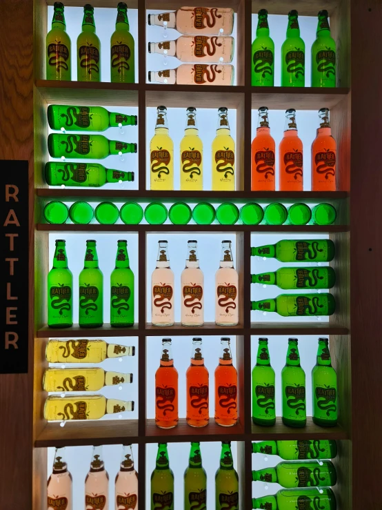 a display case filled with bottles of different drinks