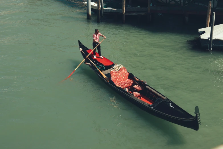 the gondola holds an arrangement of fruit and vegetables