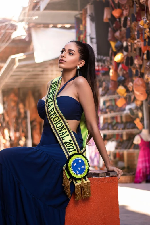 a woman wearing a large crown is posing for a picture