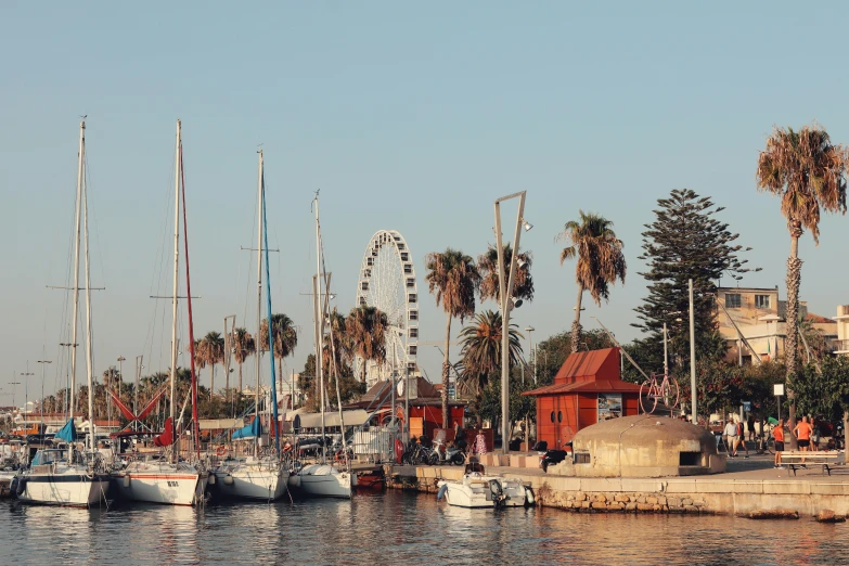 several boats are docked along a large harbor