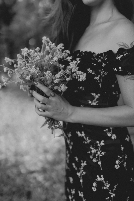 woman wearing flowers holding a bouquet of flowers