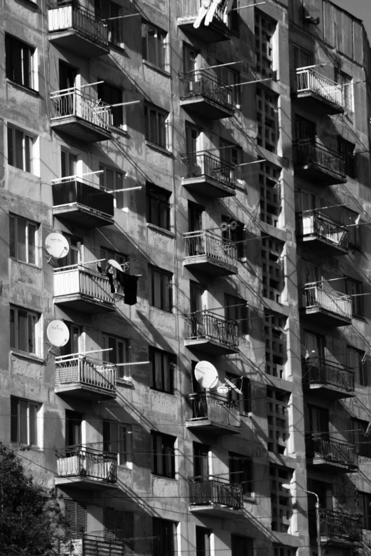 many balconies are seen on the outside of this building