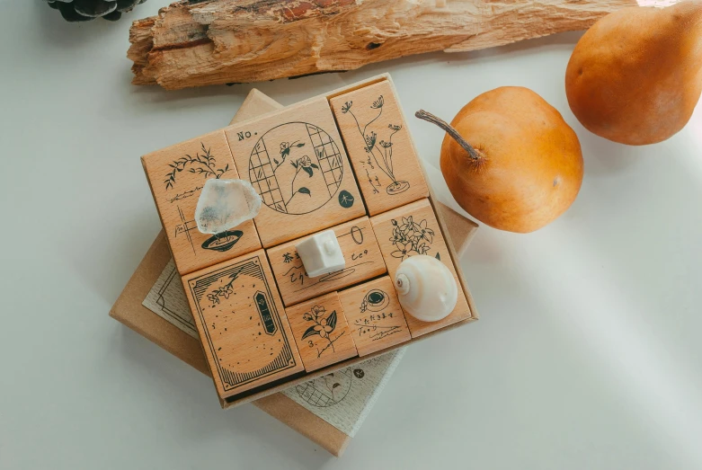 pieces of carved wooden furniture sit next to fruit